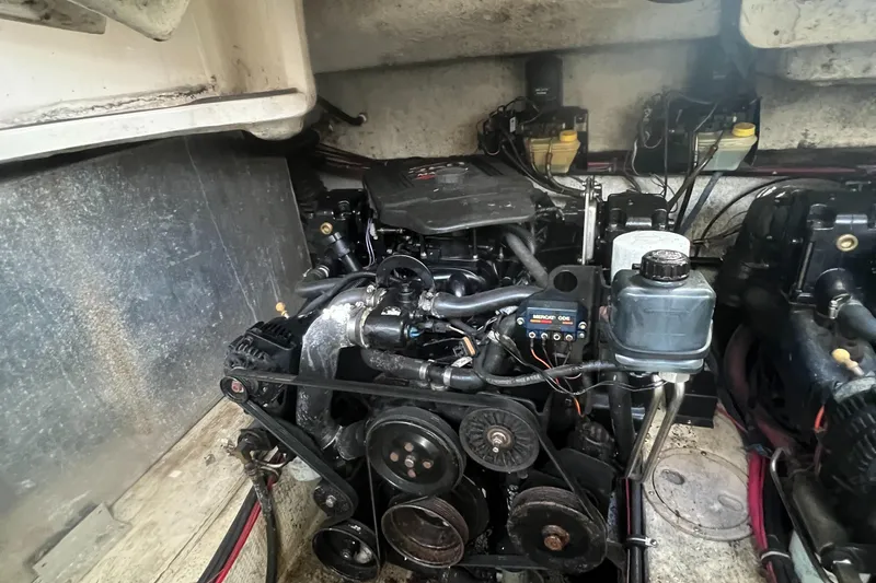 Slide: The Image of Engine compartment of a 2003 Regal Commodore 3260 boat, showcasing mechanical components. - 39