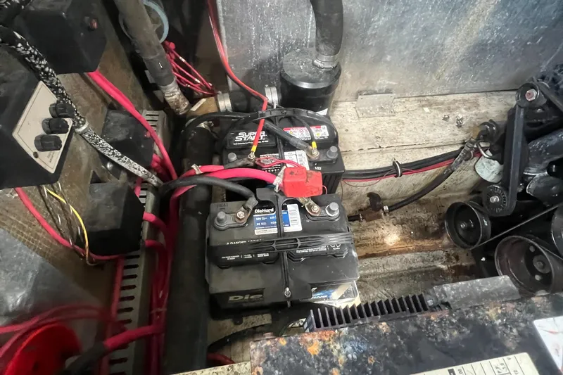 Slide: The Image of Engine compartment of 2003 Regal Commodore 3260 with visible battery and wiring. - 40