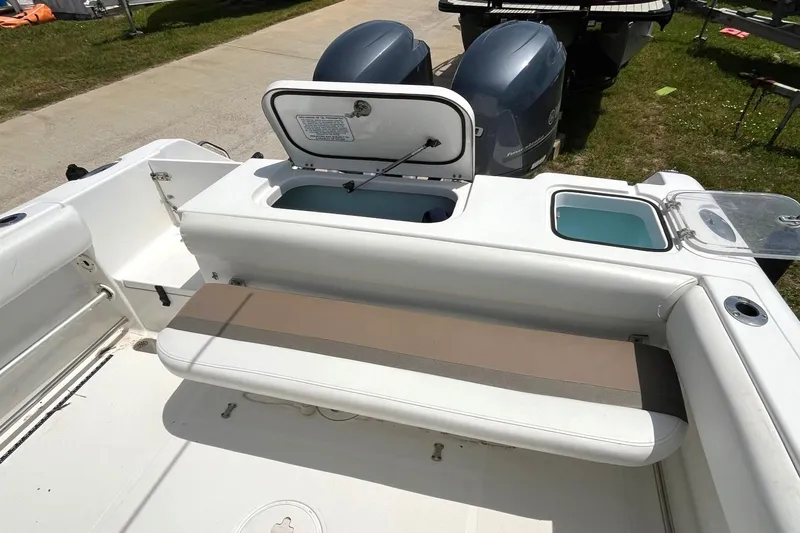 Slide: The Image of 2012 Sea Hunt Gamefish 25 boat with dual engines and seating area. - 16