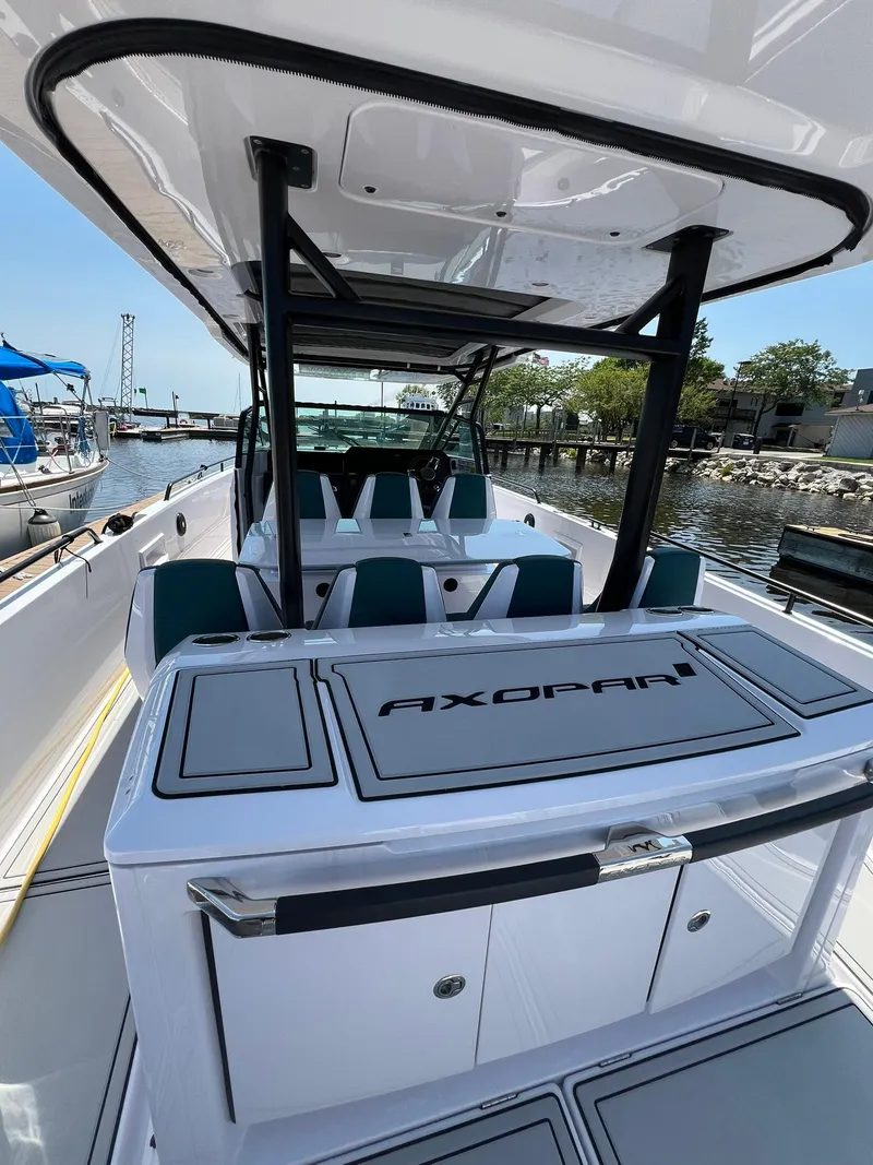 Slide: The Image of 2022 Axopar 37 Sun Top boat docked at a marina. - 10