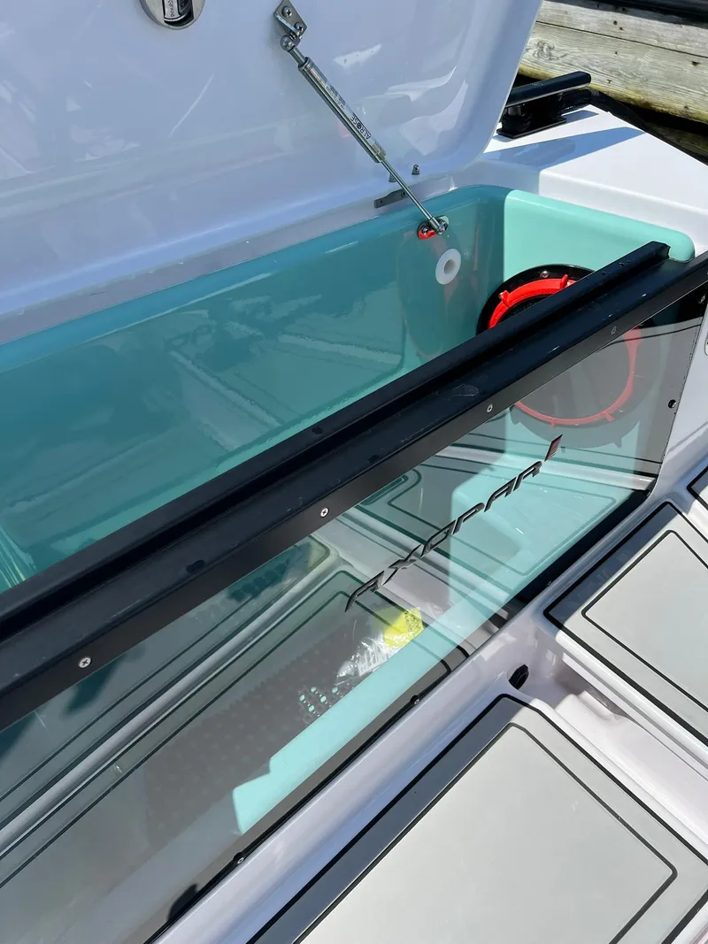 Slide: The Image of Open storage compartment of 2022 Axopar 37 Sun Top boat. - 12