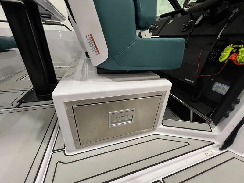 Slide: The Image of Axopar 37 Sun Top 2022 interior seating and storage compartment. - 19