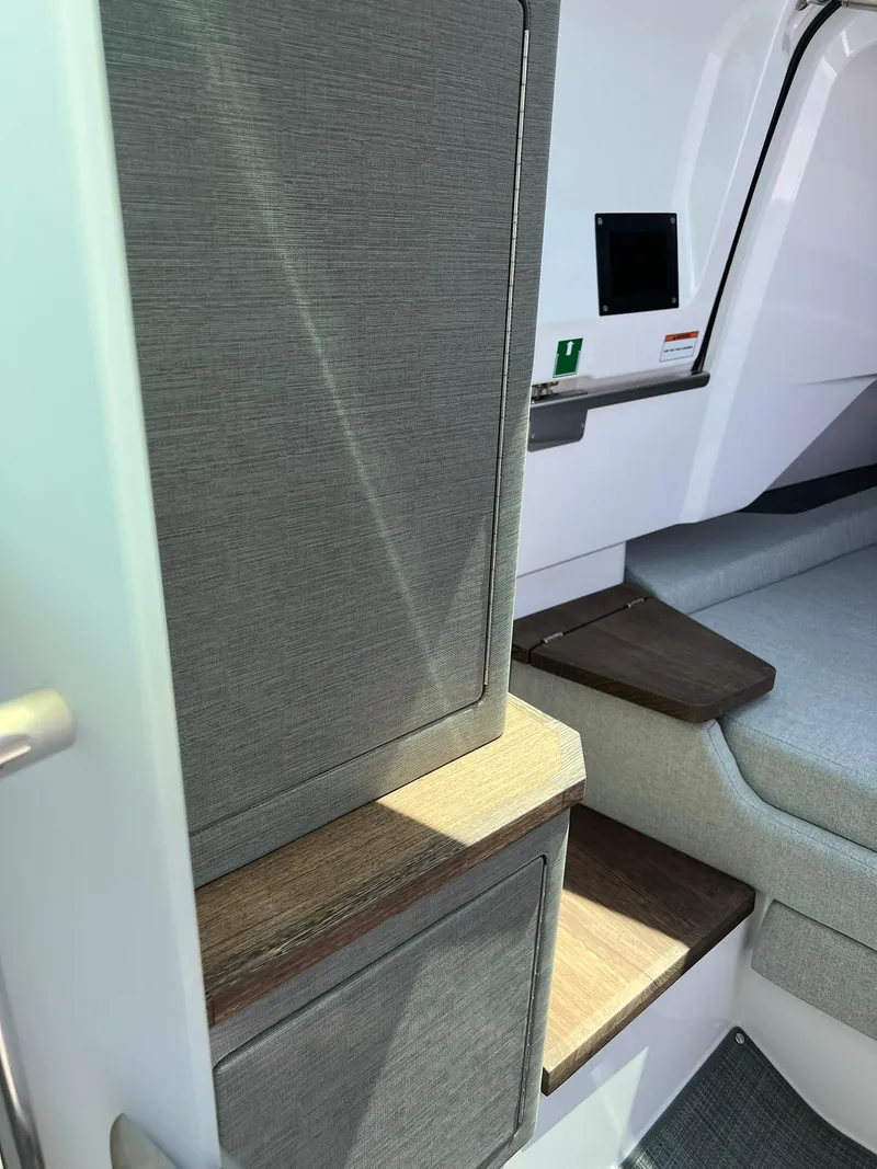 Slide: The Image of Interior of 2022 Axopar 37 Sun Top, featuring steps and modern design elements. - 20