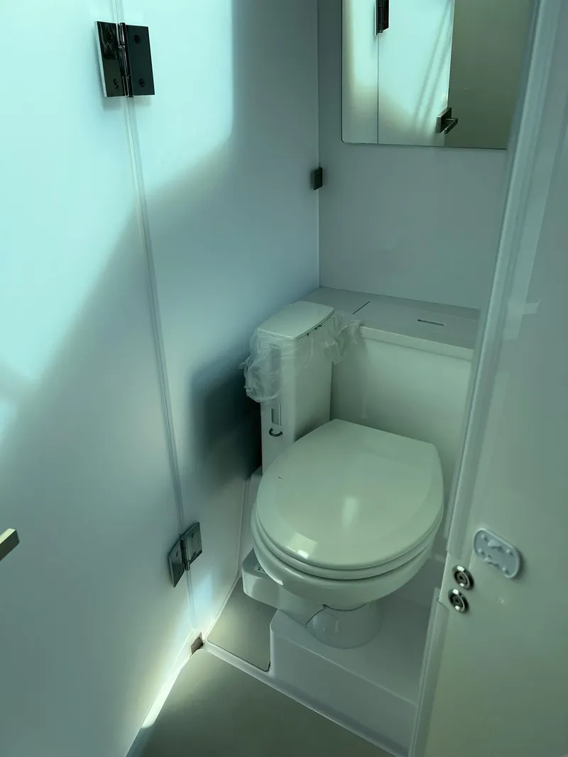 Slide: The Image of 2022 Axopar 37 Sun Top boat bathroom interior. - 23