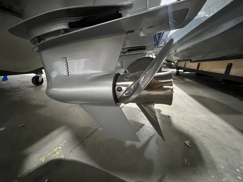 Slide: The Image of Close-up of 2022 Axopar 37 Sun Top boat propeller in a garage. - 39