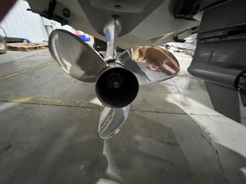 Slide: The Image of Close-up of a 2022 Axopar 37 Sun Top boat propeller in a garage. - 41