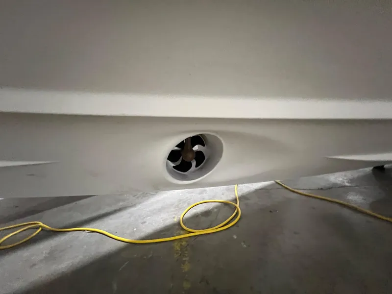 Slide: The Image of Close-up of 2022 Axopar 37 Sun Top hull with thruster and yellow cable. - 42