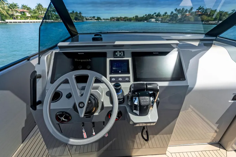 Slide: The Image of Helm of 2021 Vanquish Yachts VQ40 with modern controls and navigation screens. - 38
