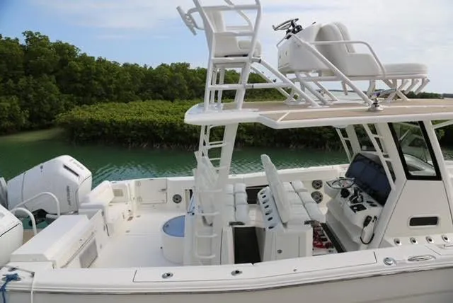 Slide: The Image of 2022 World Cat 400CC-X boat with upper deck and ocean backdrop. - 10