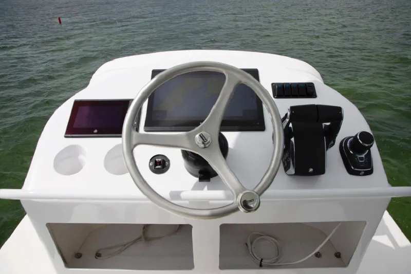 Slide: The Image of 2022 World Cat 400CC-X boat helm station on open water. - 14