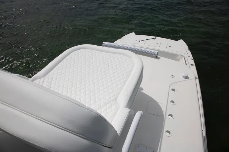 Slide: The Image of Steering console of 2022 World Cat 400 CC-X boat on water. - 16