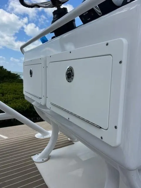 Slide: The Image of 2022 World Cat 400CC-X boat interior with white seating and spacious deck. - 21