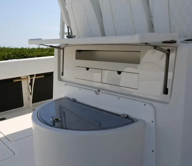 Slide: The Image of 2022 World Cat 400CC-X boat interior storage compartments and seating. - 33