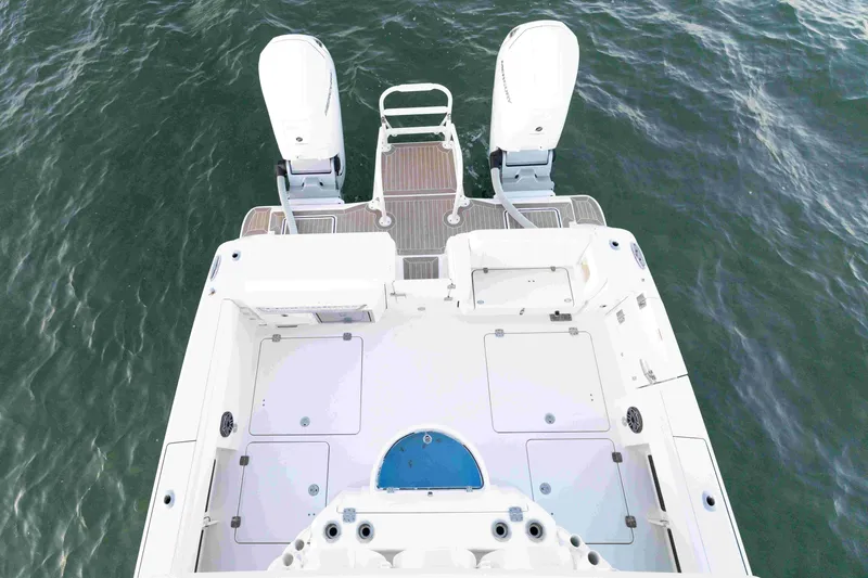 Slide: The Image of 2022 World Cat 400 CC-X boat deck with dual engines on water. - 37
