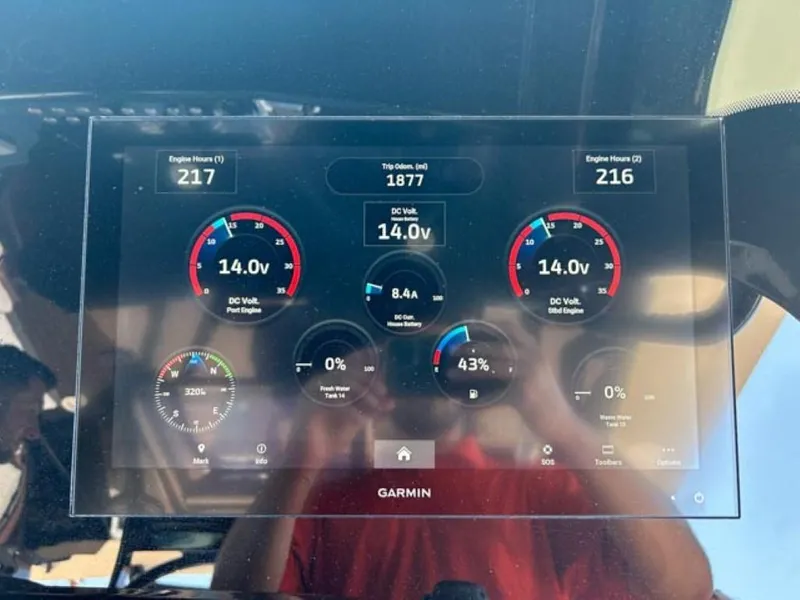 Slide: The Image of 2023 Scout 400 LXF dashboard display showing engine hours, DC volts, and other metrics. - 20