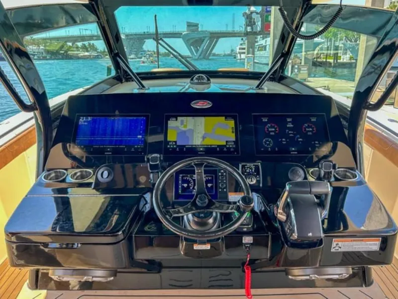 Slide: The Image of 2023 Scout 400 LXF boat dashboard with navigation and control systems. - 22