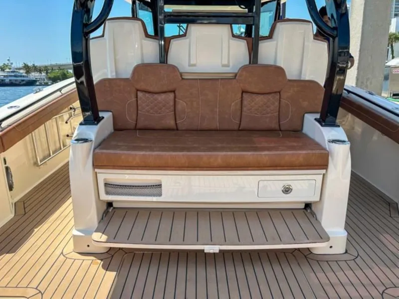 Slide: The Image of 2023 Scout 400 LXF boat with brown leather seating and teak deck. - 26