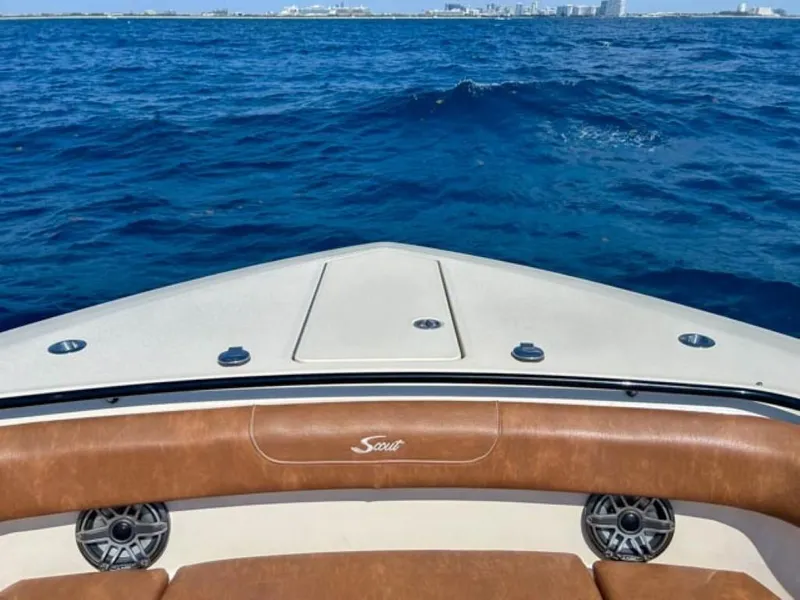 Slide: The Image of 2023 Scout 400 LXF boat on open blue ocean. - 28