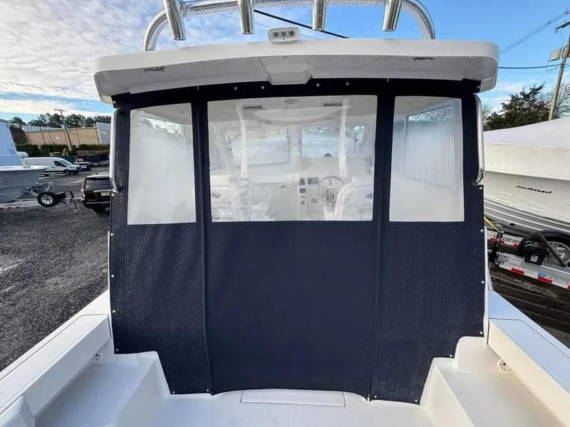 Slide: The Image of 2024 NorthCoast 255 Cabin boat with enclosed cockpit, rear view. - 23