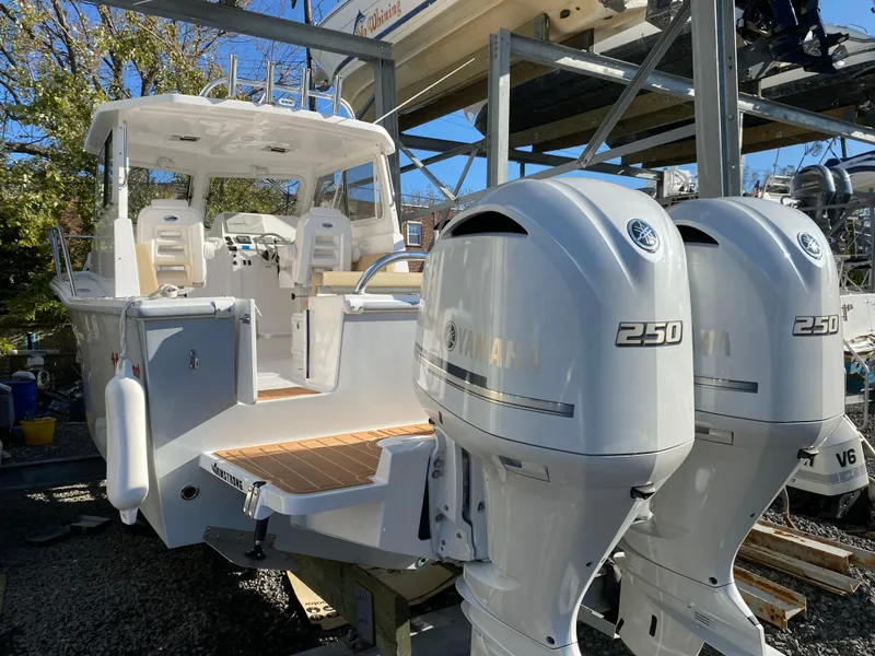 Slide: The Image of 2024 NorthCoast 255 Cabin boat with twin Yamaha 250 engines. - 31