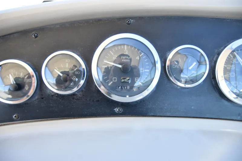 Slide: The Image of Close-up of 1998 Sea Ray 270 Sundancer boat dashboard gauges. - 12