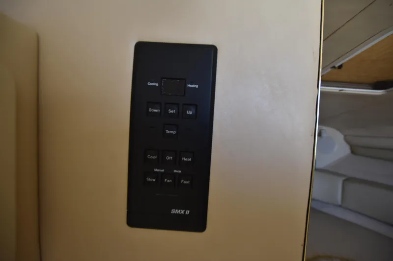 Slide: The Image of Control panel on a 1998 Sea Ray 270 Sundancer boat. - 17