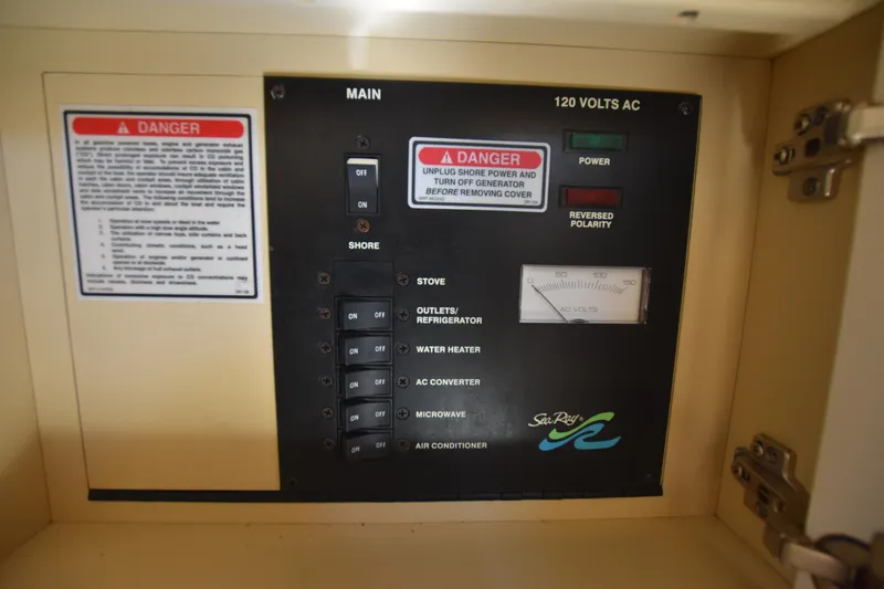 Slide: The Image of Electrical control panel of a 1998 Sea Ray 270 Sundancer boat. - 18