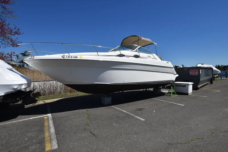 Slide: The Image of 1998 Sea Ray 270 Sundancer boat on trailer in parking lot. - 2