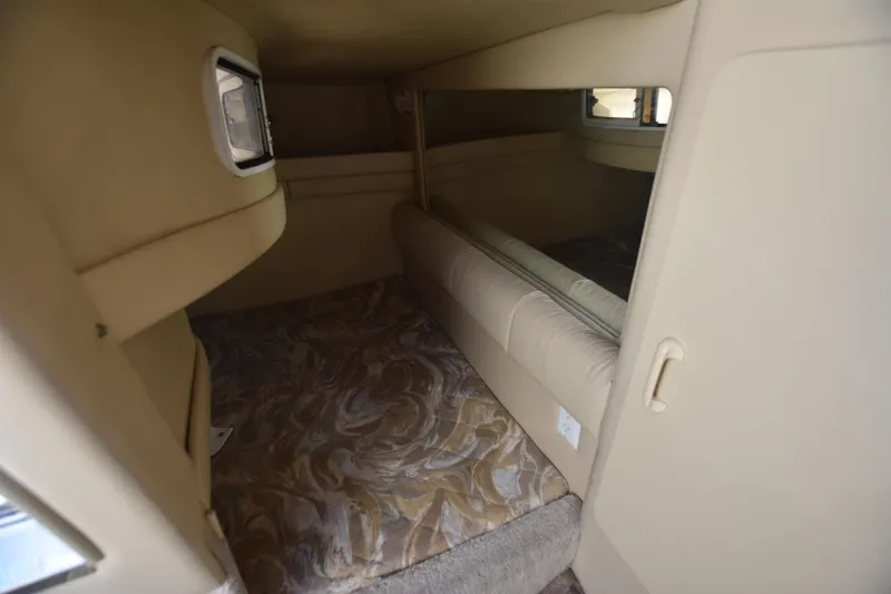 Slide: The Image of 1998 Sea Ray 270 Sundancer cabin interior with bed and mirror. - 20