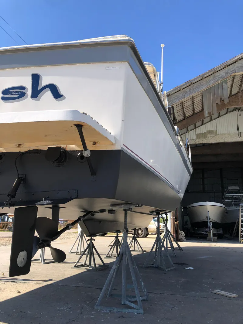 Slide: The Image of 1987 Luhrs Alura boat on stands in a boatyard. - 5