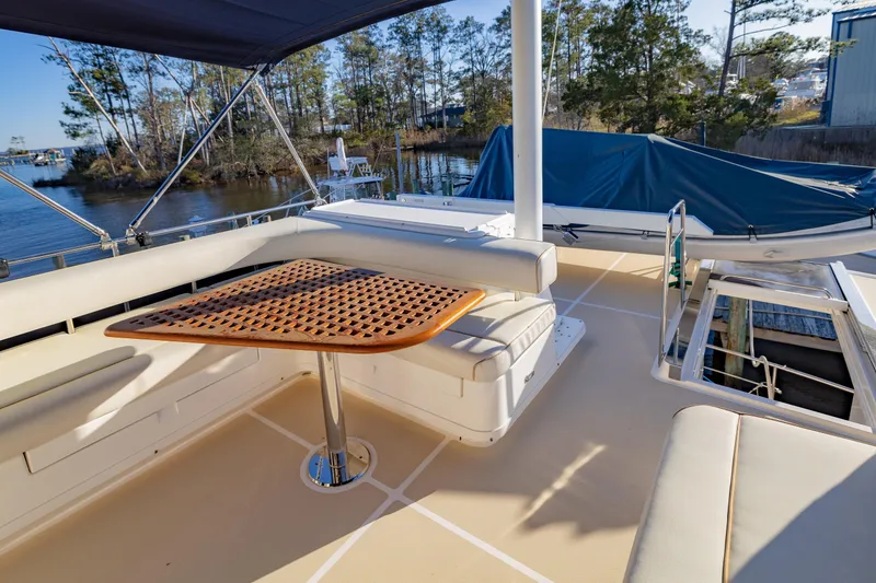 Slide: The Image of Flybridge looking aft, Table and Settees - 30