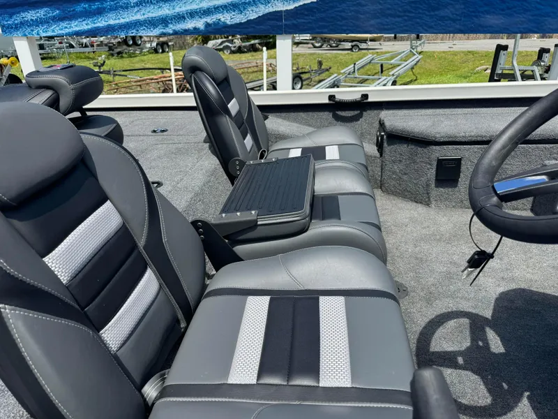 Slide: The Image of 2024 Ranger RT178 boat interior with gray and black seating. - 6