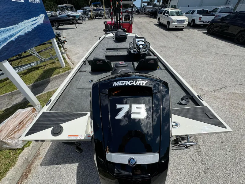 Slide: The Image of 2024 Ranger RT178 boat with Mercury 75 engine, parked in a marina. - 9