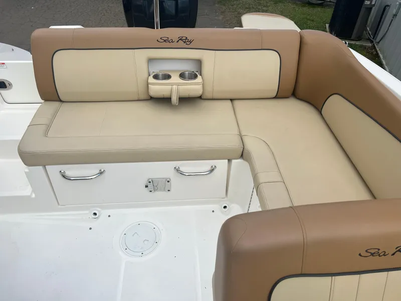 Slide: The Image of 2014 Sea Ray 240 Sundeck Outboard boat with beige and tan seating area. - 8