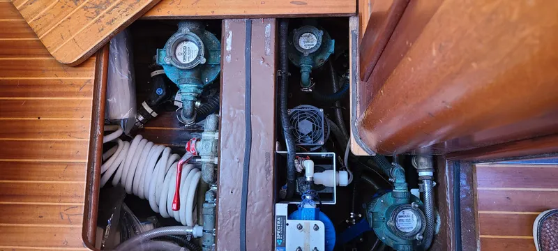 Slide: The Image of Bilge area of a 1999 Malo 45 sailboat with pumps and hoses. - 43