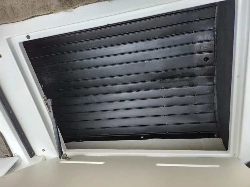 Slide: The Image of Open engine compartment of a 1998 Cobalt 200 boat. - 13