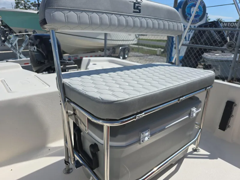 Slide: The Image of 2024 Carolina Skiff E16 JVX CC boat seat and cooler storage. - 1