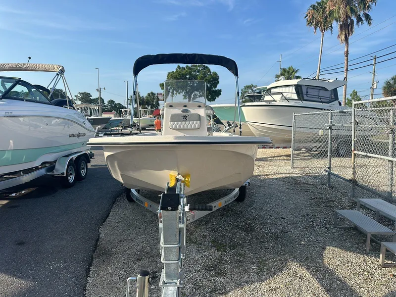 Slide: The Image of 2024 Carolina Skiff E16 JVX CC boat on trailer, parked outdoors. - 12