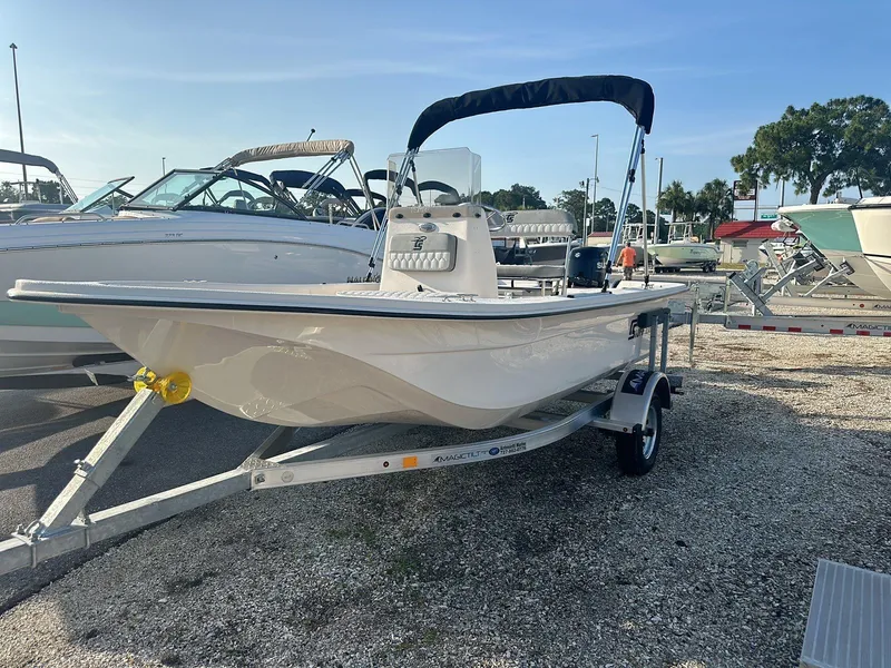 Slide: The Image of 2024 Carolina Skiff E16 JVX CC boat on trailer, parked in marina. - 13
