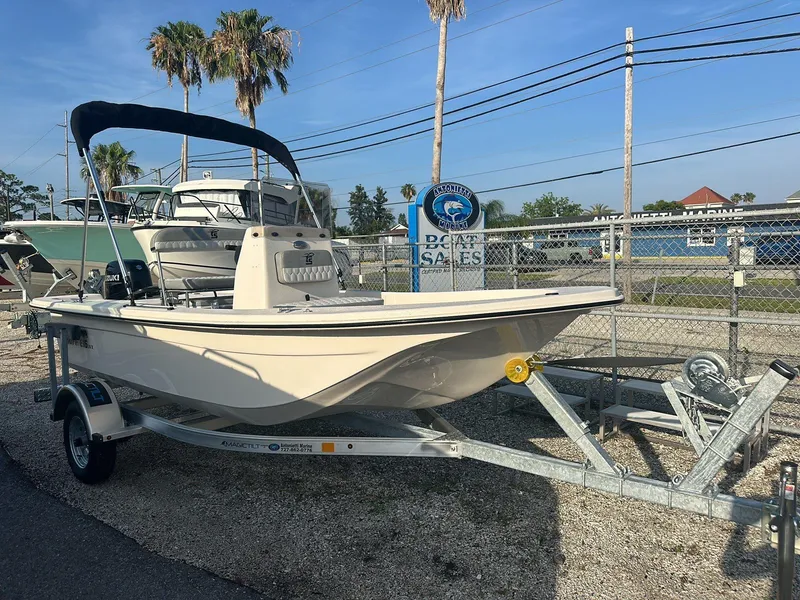 Slide: The Image of 2024 Carolina Skiff E16 JVX CC boat on trailer, parked outdoors. - 14