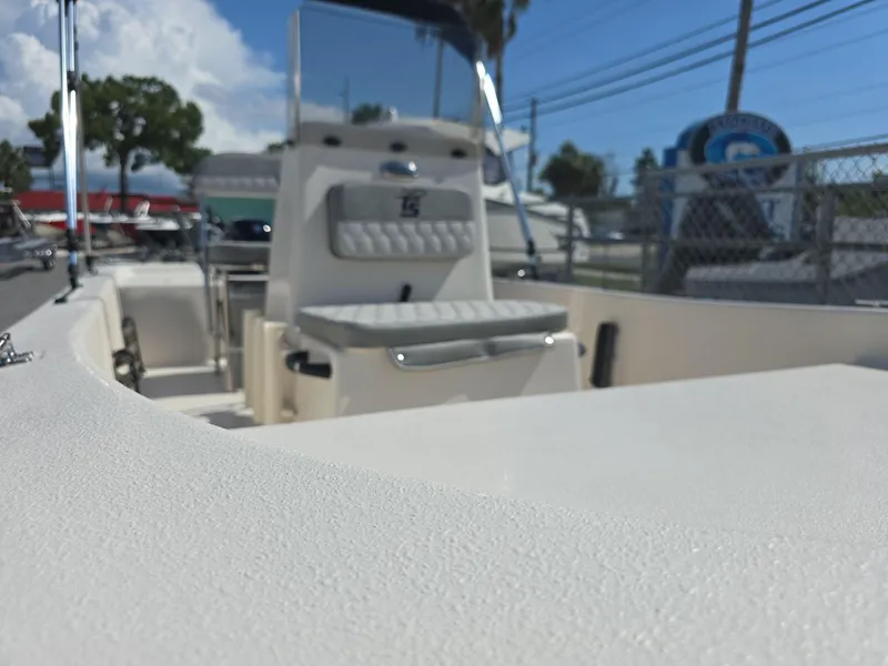 Slide: The Image of 2024 Carolina Skiff E16 JVX CC boat interior with seating and console. - 16