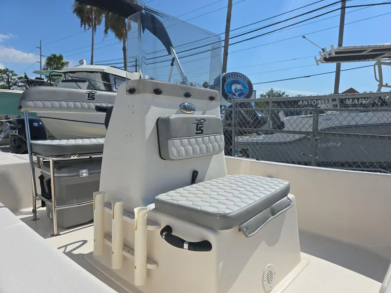 Slide: The Image of 2024 Carolina Skiff E16 JVX CC center console boat with cushioned seating. - 2