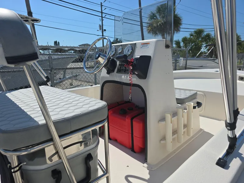 Slide: The Image of 2024 Carolina Skiff E16 JVX CC center console boat interior with steering wheel and seating. - 4