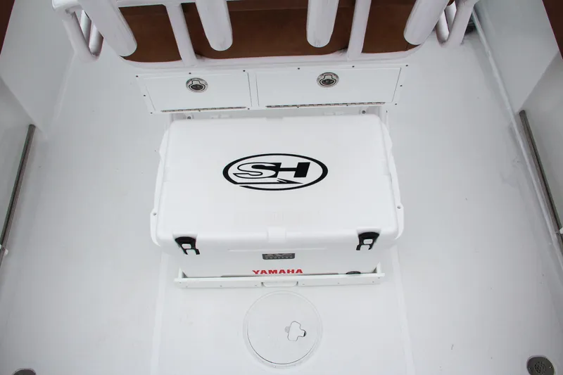 Slide: The Image of 2024 Sea Hunt Ultra 229 boat interior with Yamaha cooler. - 20