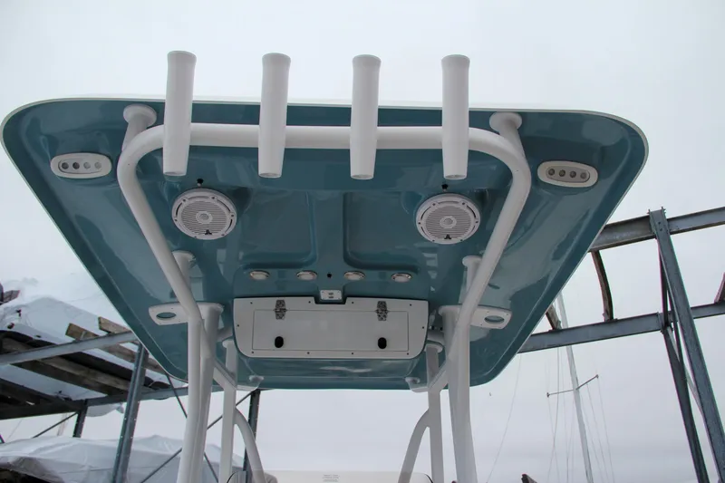Slide: The Image of 2024 Sea Hunt Ultra 229 boat T-top with rod holders and speakers. - 22