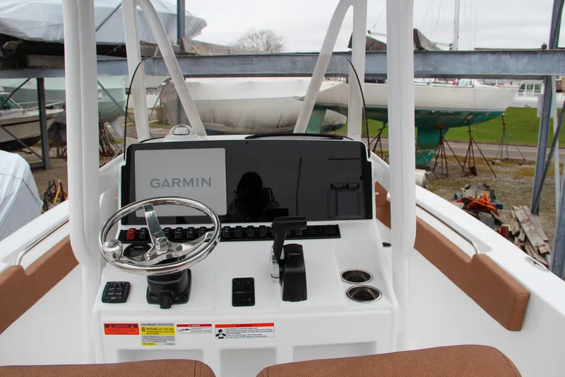 Slide: The Image of 2024 Sea Hunt Ultra 229 boat dashboard with Garmin navigation system. - 27