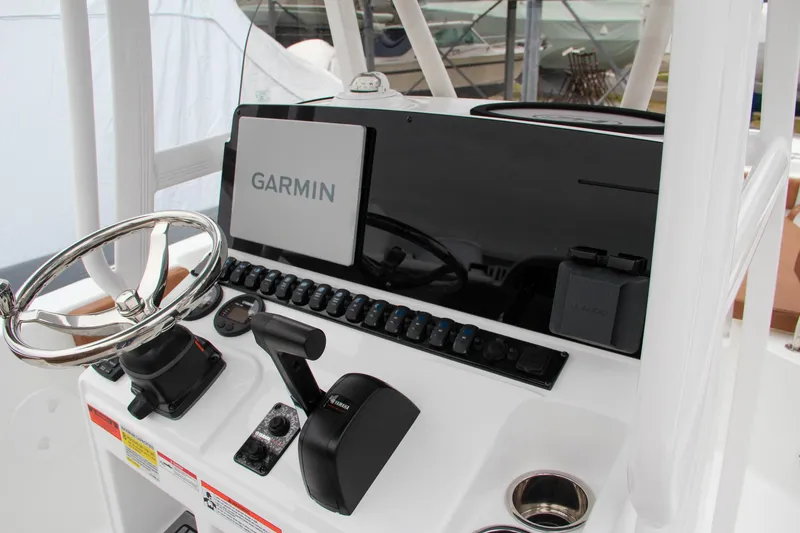 Slide: The Image of 2024 Sea Hunt Ultra 229 boat dashboard with Garmin navigation system. - 28