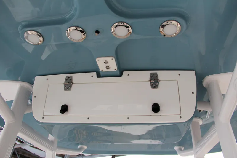Slide: The Image of 2024 Sea Hunt Ultra 229 boat console with storage compartment and LED lights. - 35