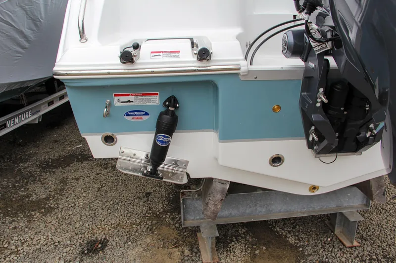 Slide: The Image of 2024 Sea Hunt Ultra 229 boat stern with motor and accessories. - 6