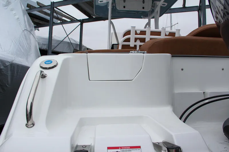 Slide: The Image of 2024 Sea Hunt Ultra 229 boat interior, rear seating and storage area. - 7